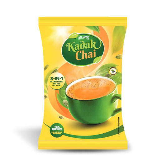 Atlantis Kadak Tea 3-in-1 Premix pack with a green cup filled with hot tea on a yellow background