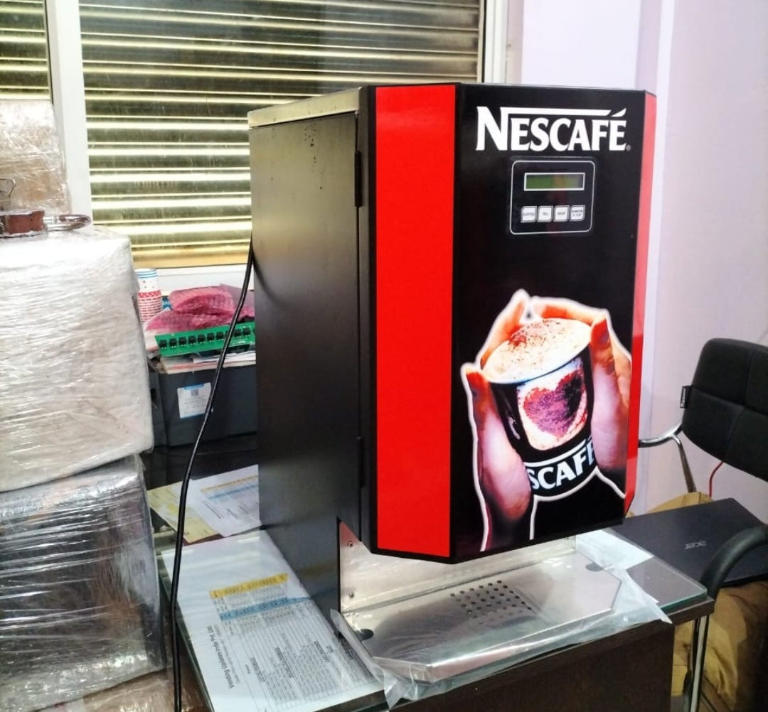 Nescafe Coffee Machine 3 Line black and red vending machine on a desk from Tea coffee vending service