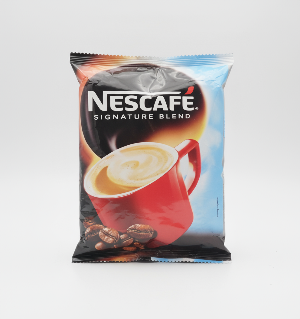 Nescafe Signature Blend vending coffee packet featuring a red cup with creamy coffee and coffee beans