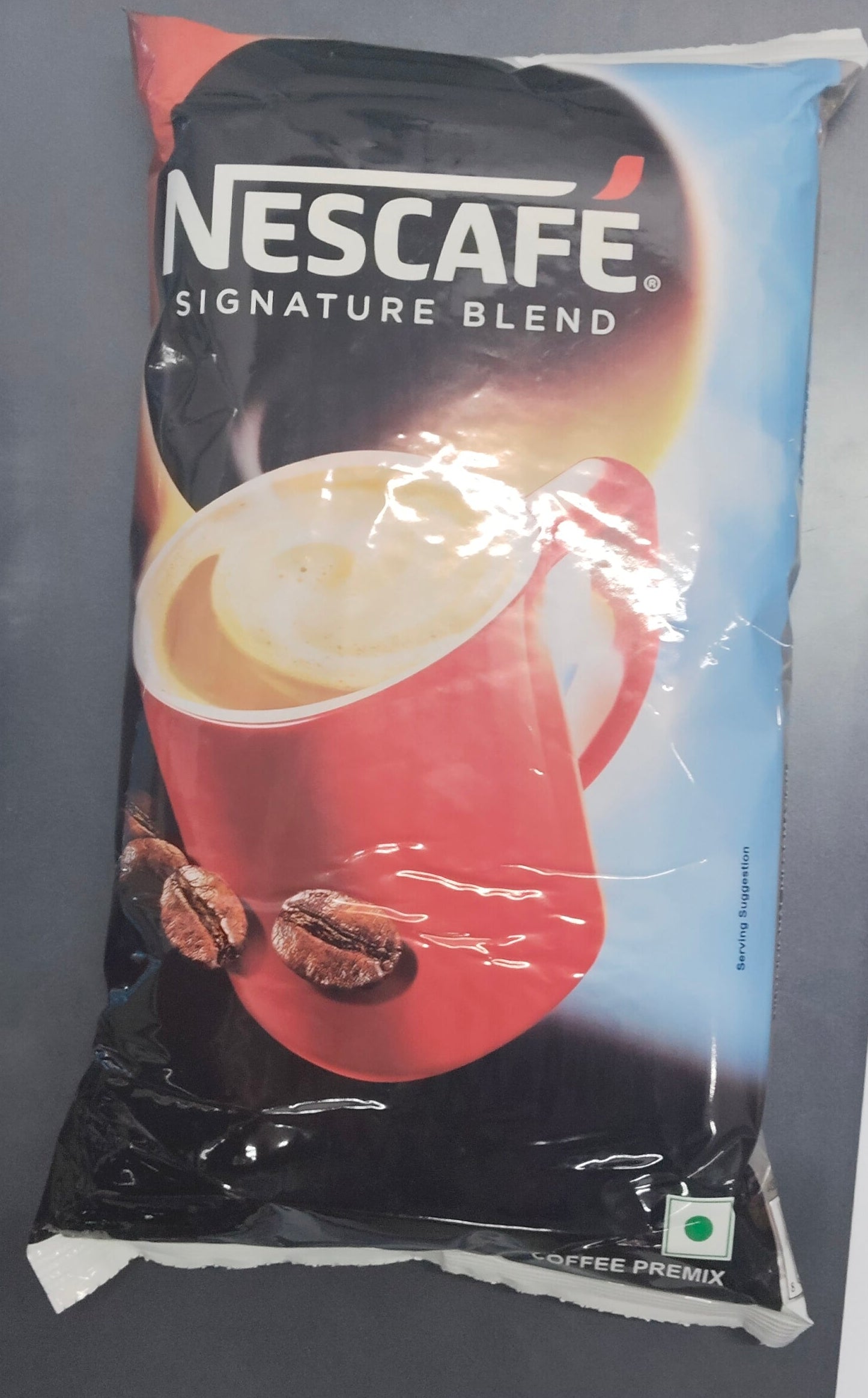 Nescafe Signature Blend vending coffee premix pack featuring a red cup of coffee with coffee beans