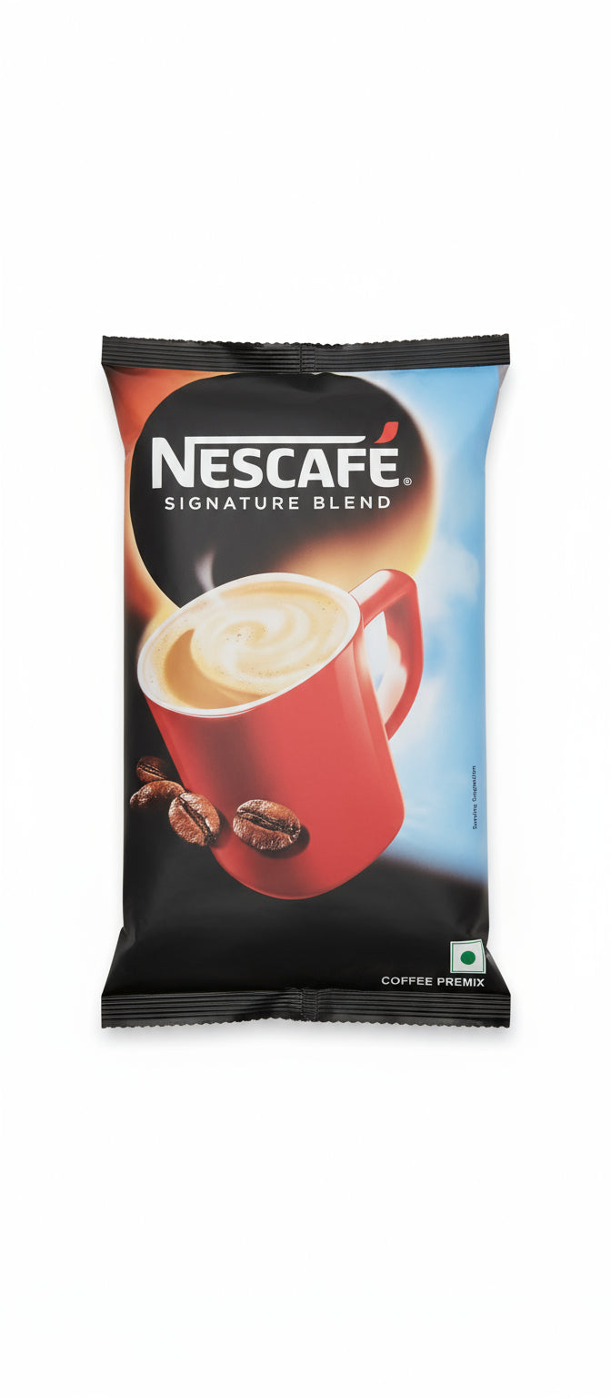 Nescafe Signature Blend vending coffee packet with a red cup of creamy coffee and coffee beans
