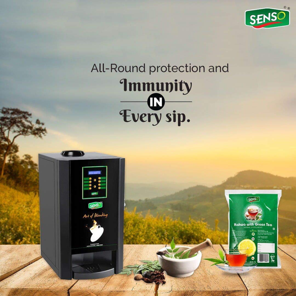 SENSO Instant Kahwa with Green tea package with hot cup and tea maker on wooden table in nature