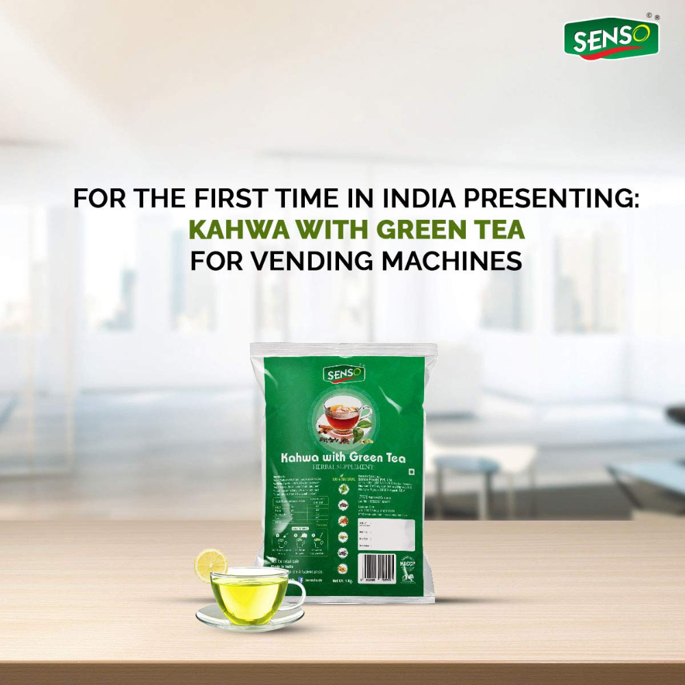 SENSO Instant Kahwa with Green pouch next to a cup of green tea on a wooden table for vending machines